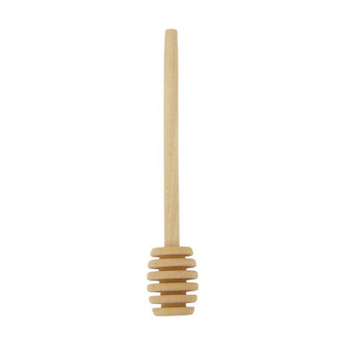 Wooden honey dipper on a white background