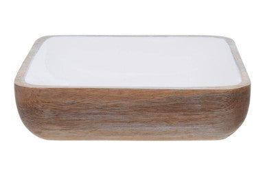 Rectangular dish with wooden base and white ceramic top on a white background