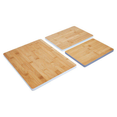 Three bamboo cutting boards on a white background