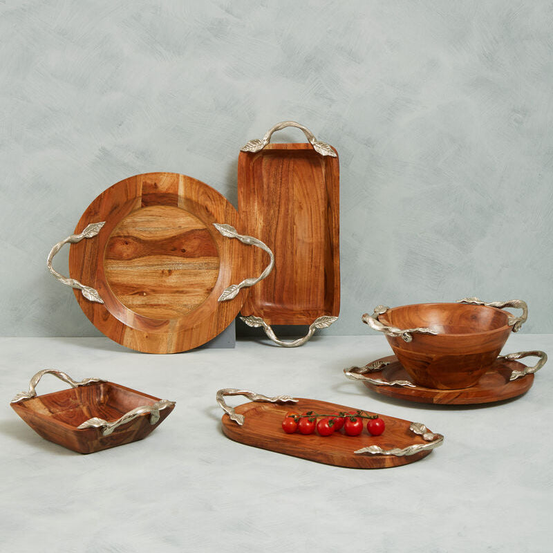 Set of wooden serving trays with metal handles on a gray background