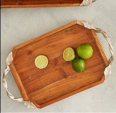 Wooden trays with handles on a light gray background