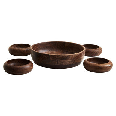 Set of five wooden bowls of different sizes on a white background