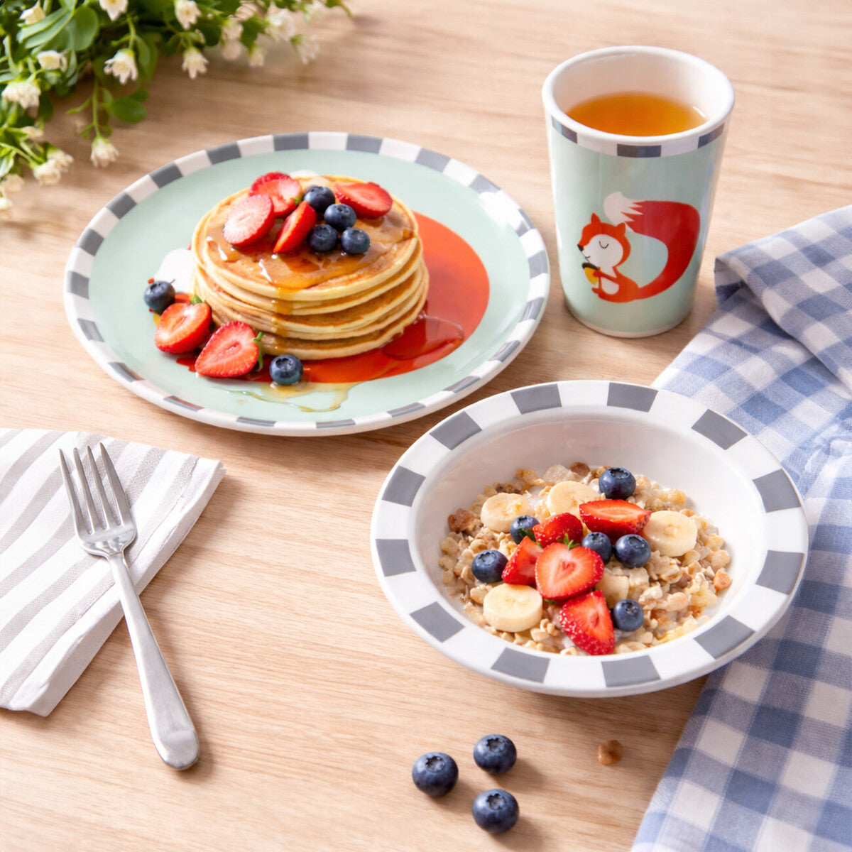 Breakfast setting with pancakes, cereal, and a cup on a wooden table.