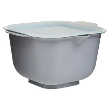 Gray mixing bowl with a lid on a white background