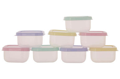 Set of pastel-colored food storage containers on a white background