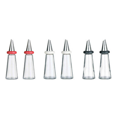 Set of six clear plastic nozzles with metal tips on a white background