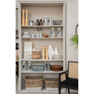 Kitchen cabinet with various kitchenware items including bowls, plates, and bottles.