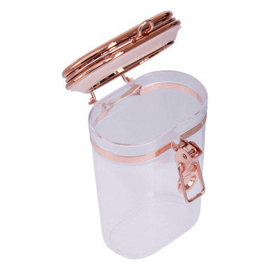 White cylindrical container with rose gold lid and clasp on a white background