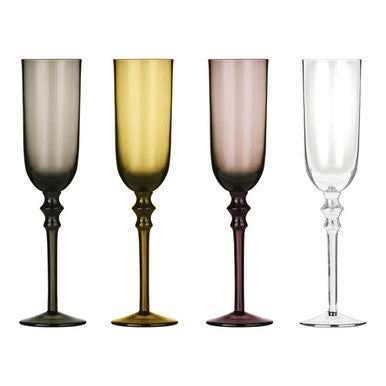 Set of four champagne flutes with gradient colors on a white background