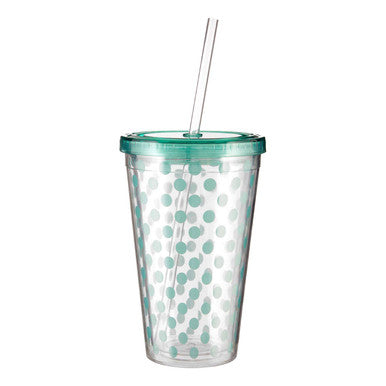 Clear tumbler with green polka dots and a straw on a white background