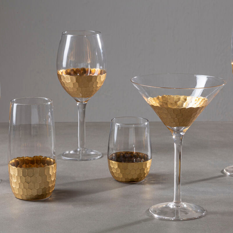 Set of glassware with gold accents on a gray surface