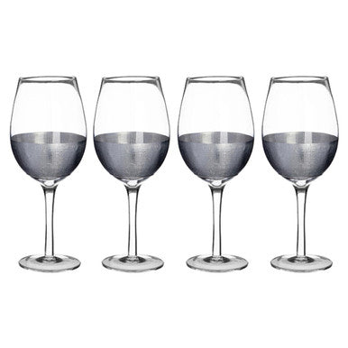Set of four wine glasses on a white background