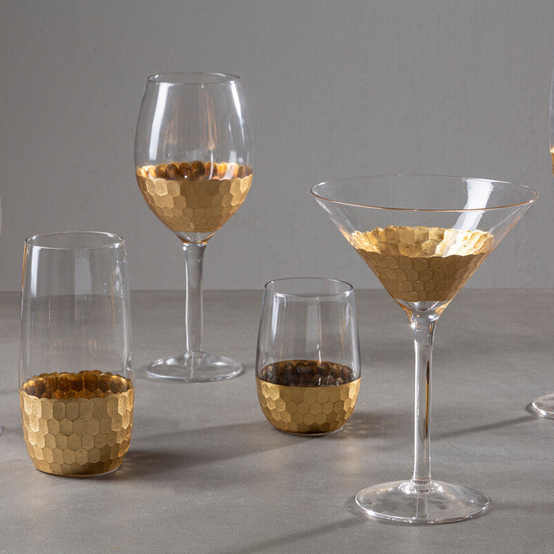 Set of glassware with gold accents on a gray surface