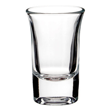 Clear glass shot glass on a white background