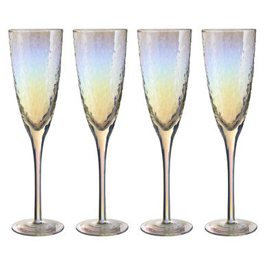 Set of four iridescent champagne flutes on a white background