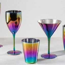 Set of rainbow-colored glassware on a light background