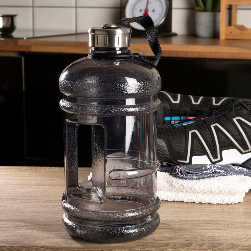 Large water container and athletic shoe on a kitchen counter