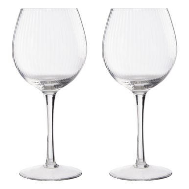 Two clear wine glasses on a white background