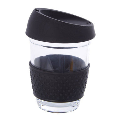 Clear glass mug with black silicone sleeve and lid on a white background