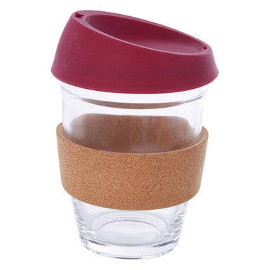 Clear glass mug with a red lid and cork sleeve on a white background