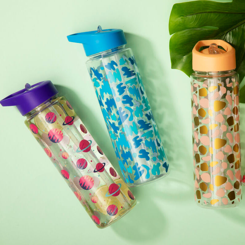 Four colorful water bottles with different designs on a light green background
