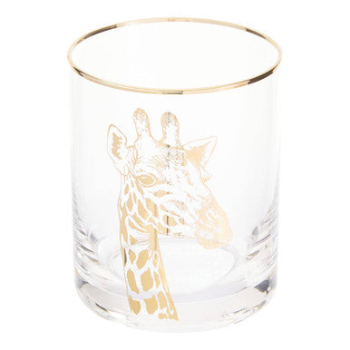 Clear glass tumbler with gold rim and giraffe design on a white background
