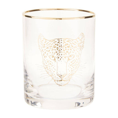 Clear glass tumbler with gold leopard engraving on a white background