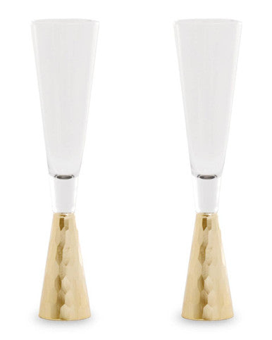 Two white wine glasses with gold bases on a white background