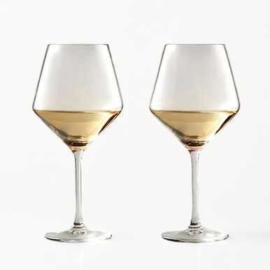 Two wine glasses filled with white wine on a white background
