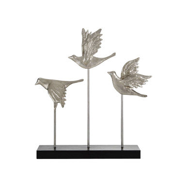 Decorative sculpture of three silver birds on a black base against a white background