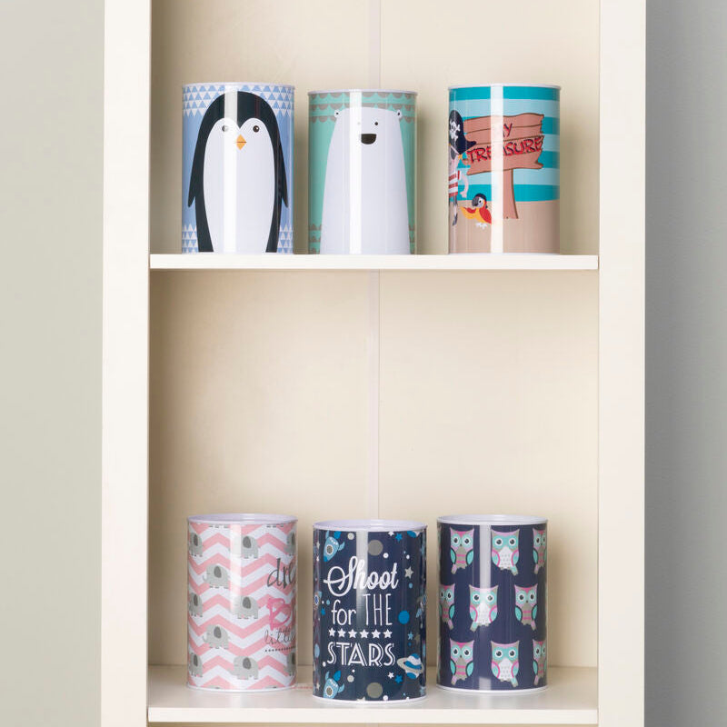 Set of colorful mugs on a white shelf against a gray wall