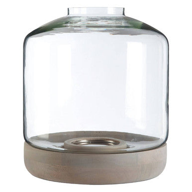 Clear glass lantern with wooden base on a white background