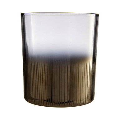 Gradient glass with dark base and clear top on a white background