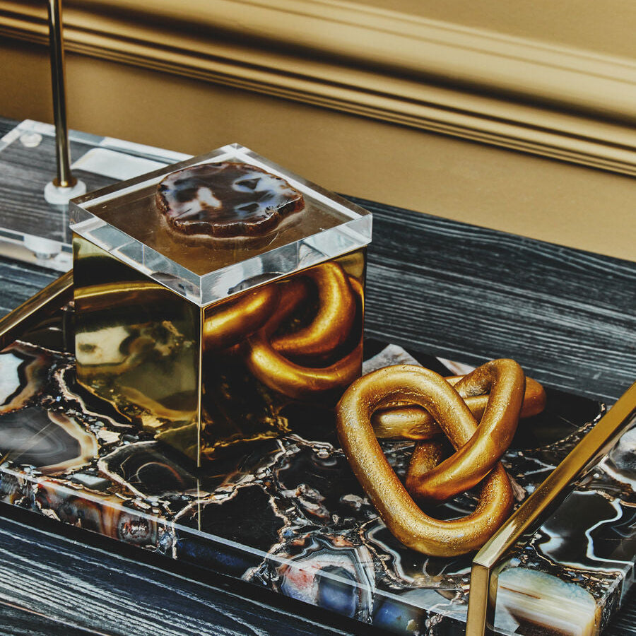 Decorative tray with pretzels on a marble surface