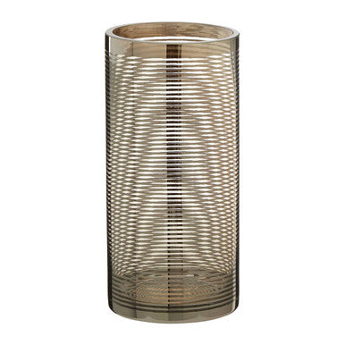 Cylindrical glass vase with ribbed design on a white background