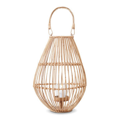 Wicker lantern with a candle inside on a white background