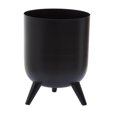 Black plant pot with legs on a white background