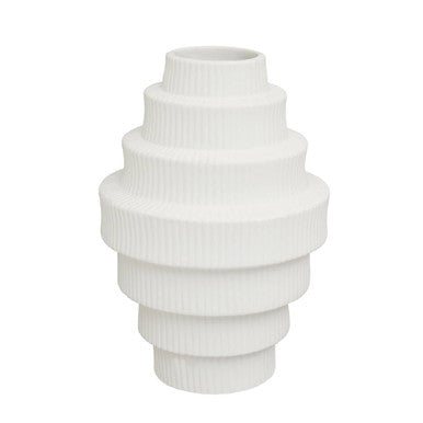 White ceramic vase with ribbed texture on a white background