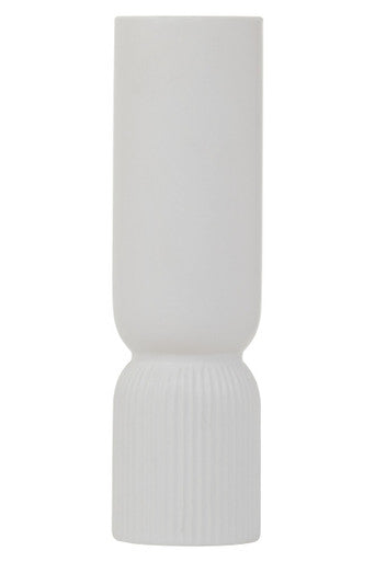 White ceramic vase with ribbed design on a white background