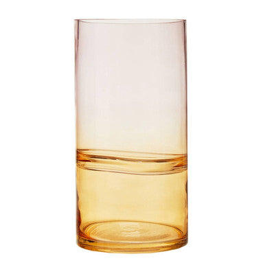 Gradient glass tumbler transitioning from peach to clear on a white background