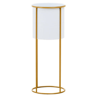 White lamp with gold base on a white background