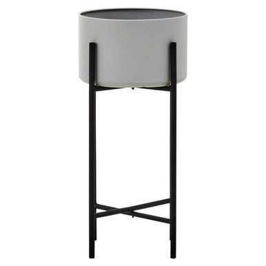 Gray planter on a black stand against a white background