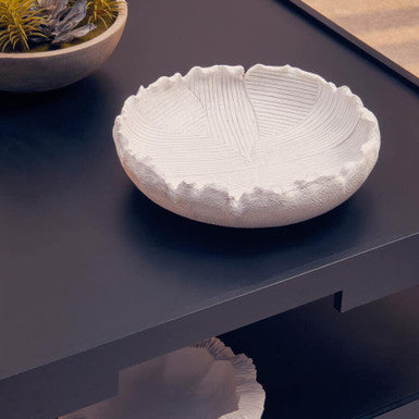 White textured ceramic bowl on a dark surface