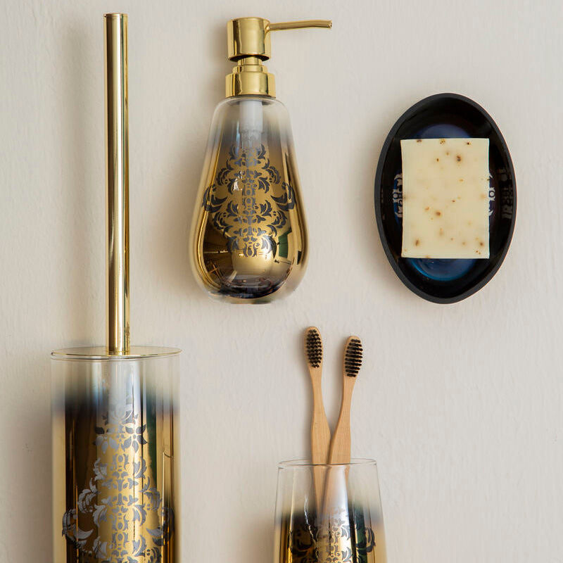 Bathroom accessories including a toilet brush, soap dispenser, and toothbrushes on a neutral background.