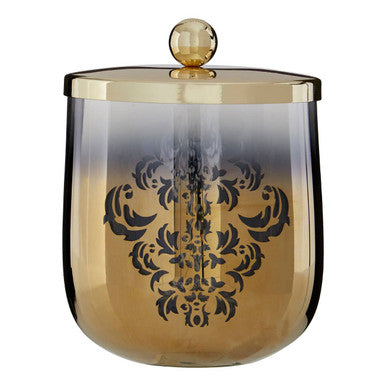Decorative glass jar with gold lid on a white background