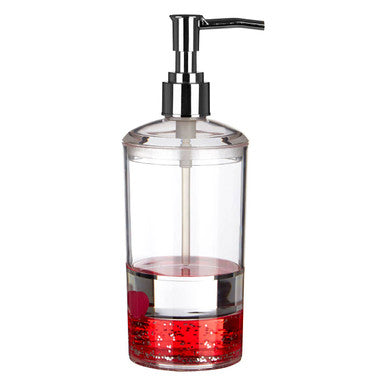 Clear glass soap dispenser with red liquid inside on a white background
