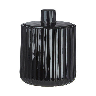 Black ribbed candle holder on a white background