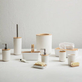 Set of bathroom accessories including cups, soap dishes, and a toothbrush holder on a light gray background.