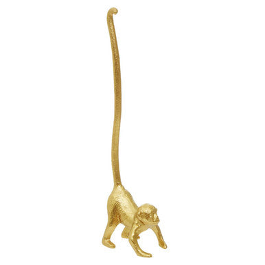 Gold monkey figurine on a white background