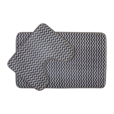 Gray and white zigzag patterned bath mat set on a white background